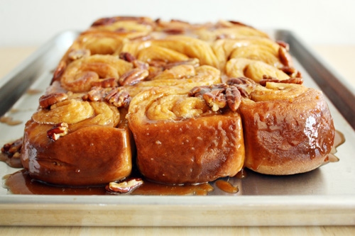 orange pecan sticky buns on baking sheet