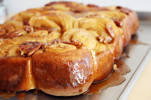 orange pecan sticky buns on baking sheet