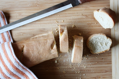 overhead view of sliced french baguette