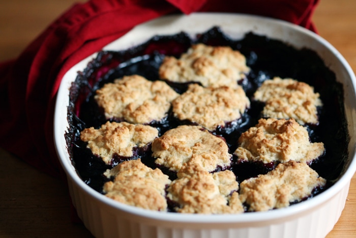 blueberry cherry cobbler in baking dish