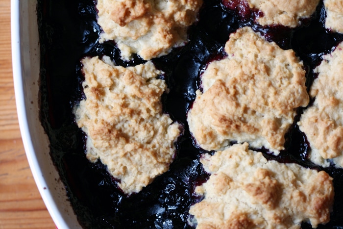 blueberry cherry cobbler in baking dish