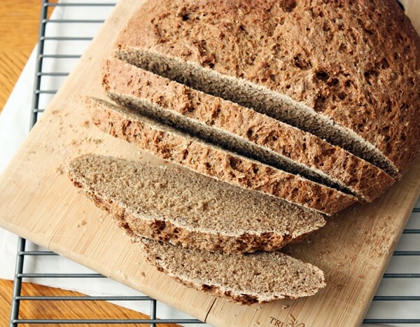 russian black bread loaf on cutting board.