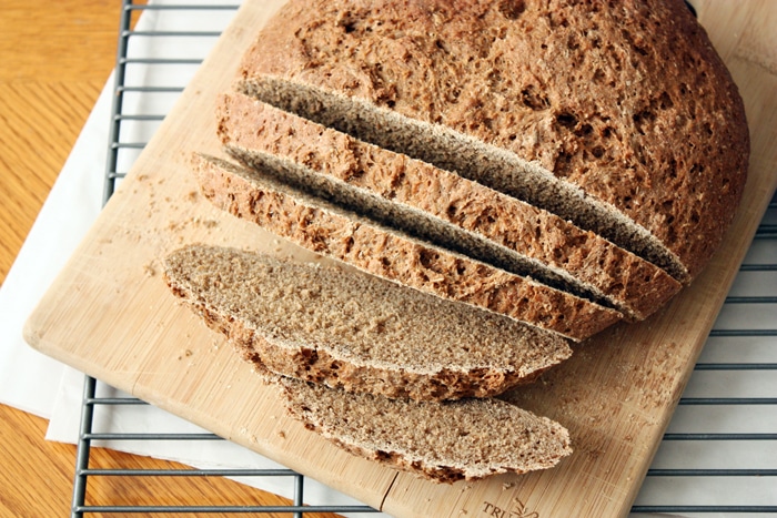 russian black bread loaf on cutting board