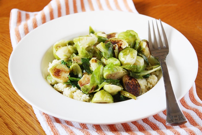sauteed brussels sprouts with couscous in bowl