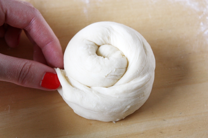 rolling brioche hamburger bun dough