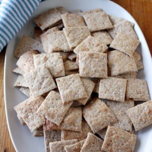 parmesan sea salt and pepper crackers on plate.