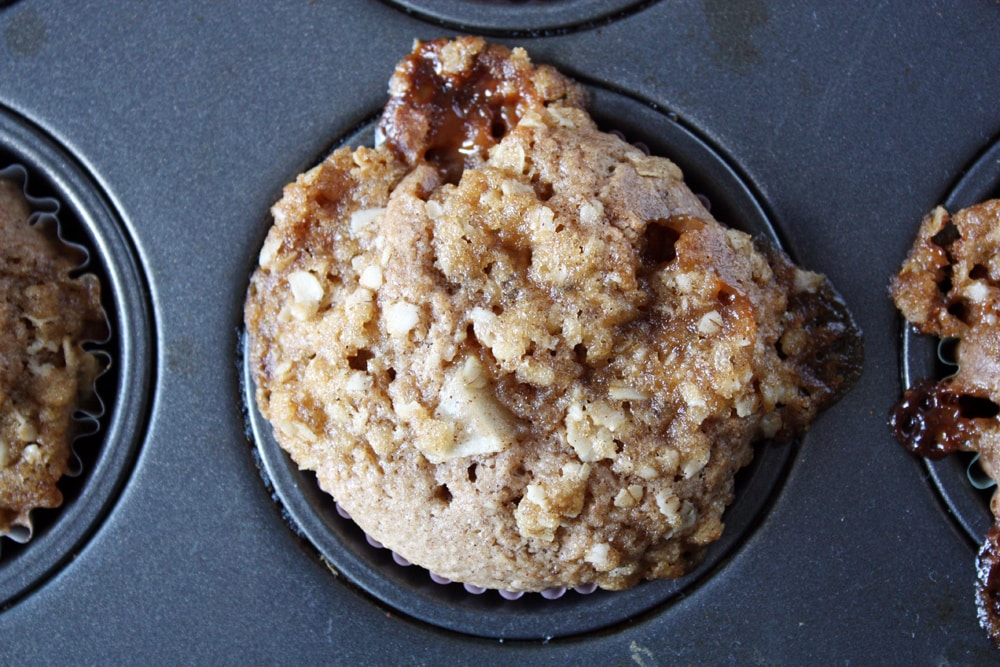 close up caramel pear muffin in muffin pan