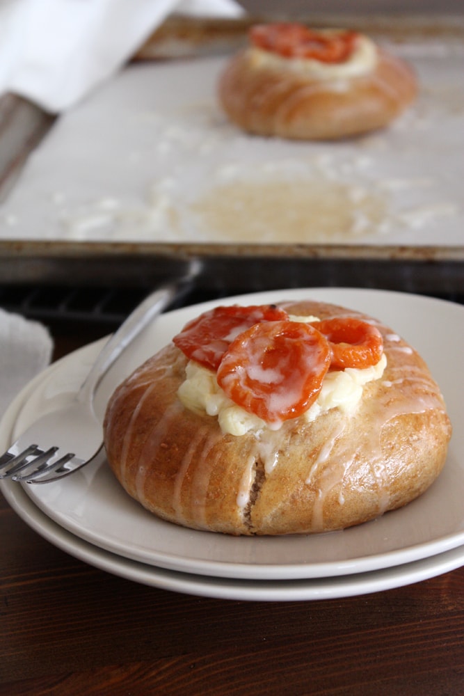 whole wheat brioche danish with honey glazed apricots on plate