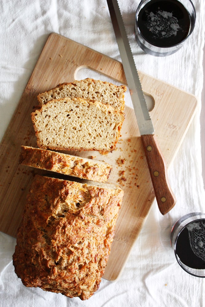 gruyere rosemary beer bread on cutting board