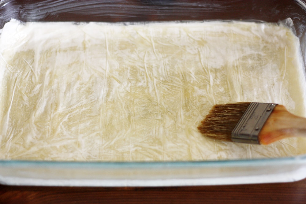 preparing phyllo dough to make casserole