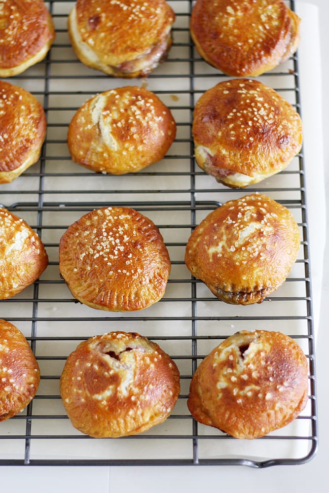 baked brie jam pretzel hand pies on cooling rack