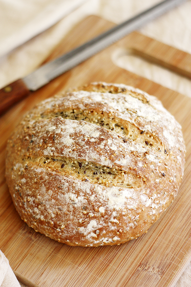 crusty no knead bread on cutting board