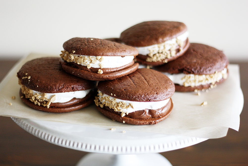 double chocolate s'mores whoopie pies on a cake stand