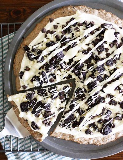 cookies and creme dessert pizza on a baking pan