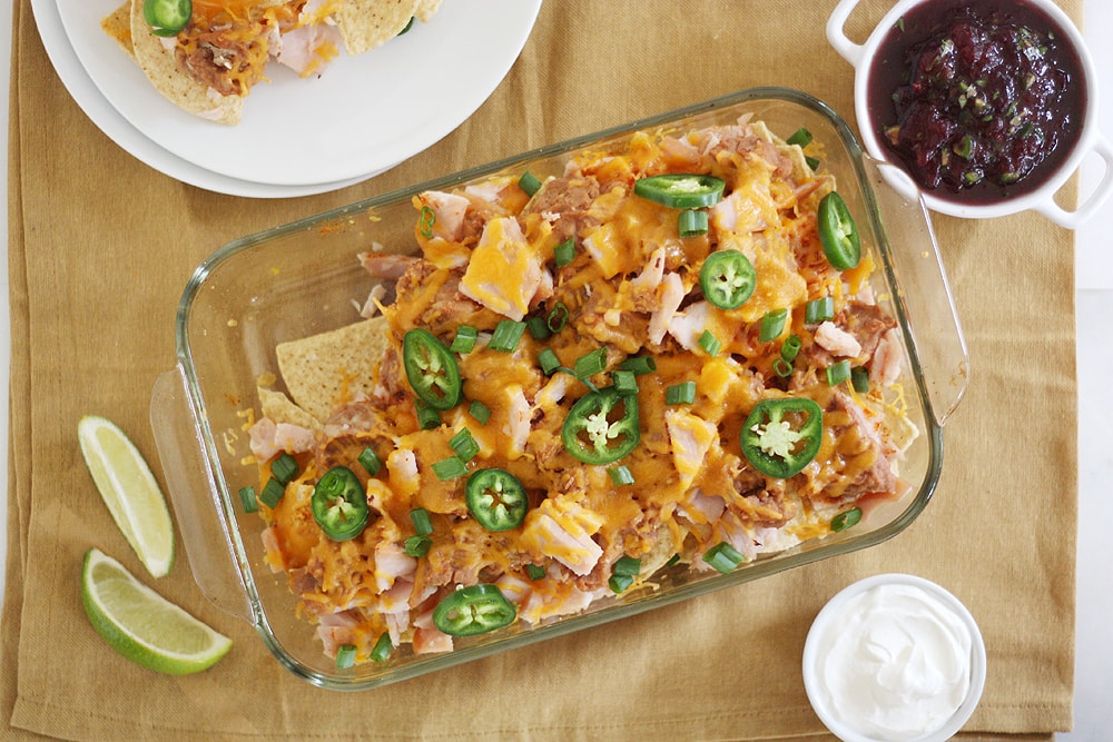 thanksgiving leftovers nachos in baking dish on a table