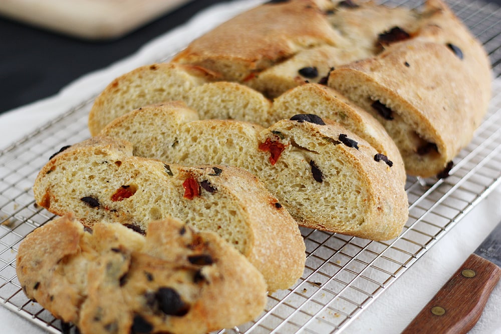 sliced sun dried tomato bread on cooling rack