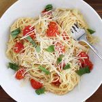 one pot pasta with tomatoes and basil.