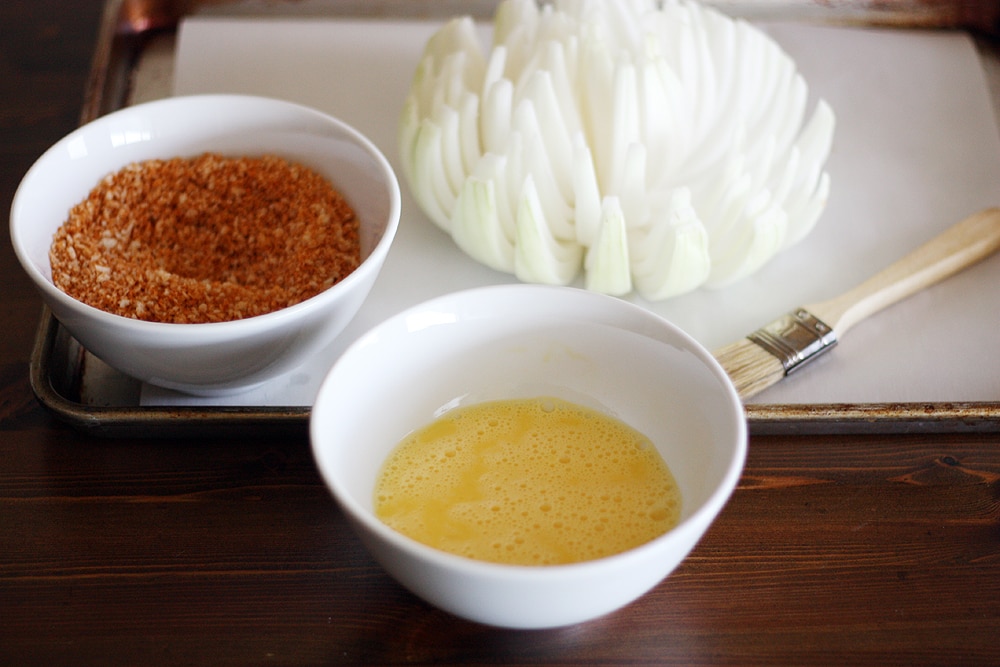 preparing the blooming onion for seasoning