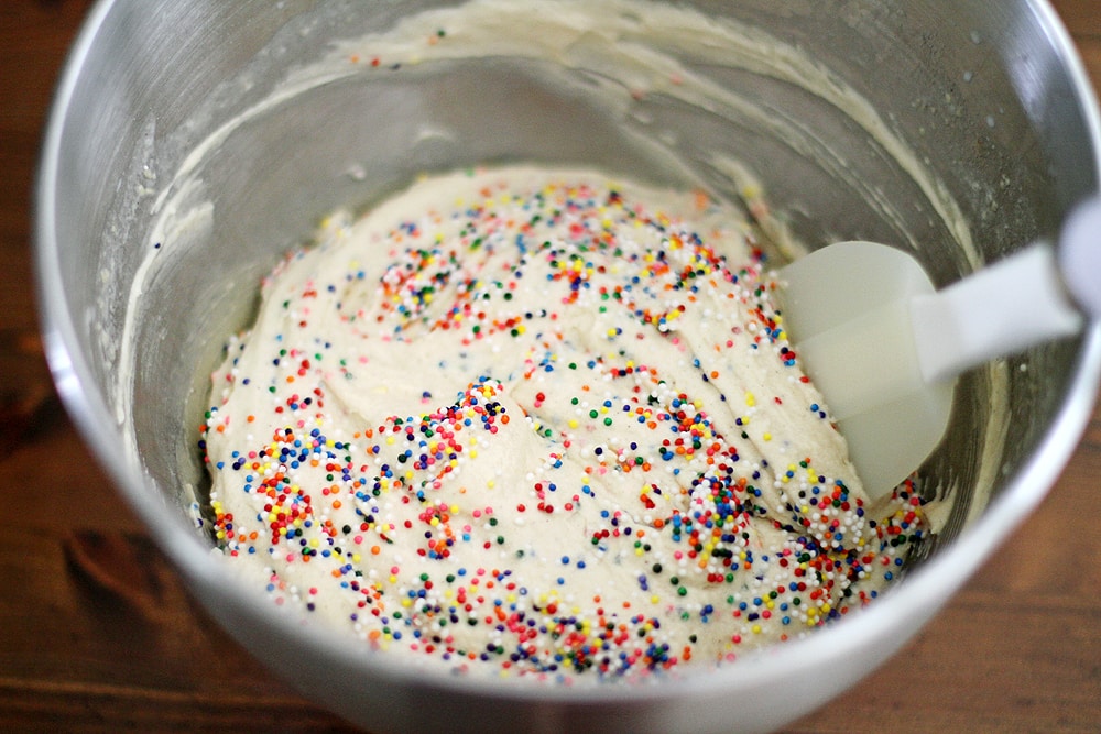 mixing funfetti cupcakes batter in bowl