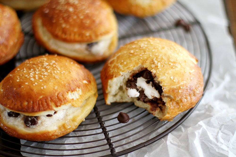 close up filling of smores pretzel hand pies on cooling rack