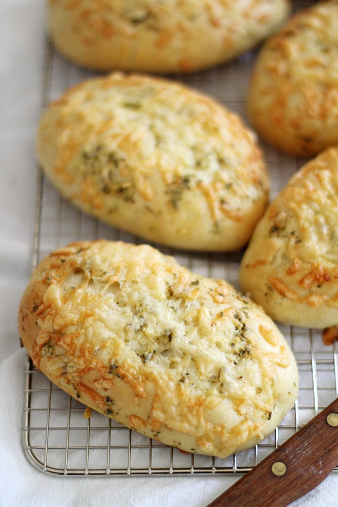 asiago herb hoagie rolls on cooling rack