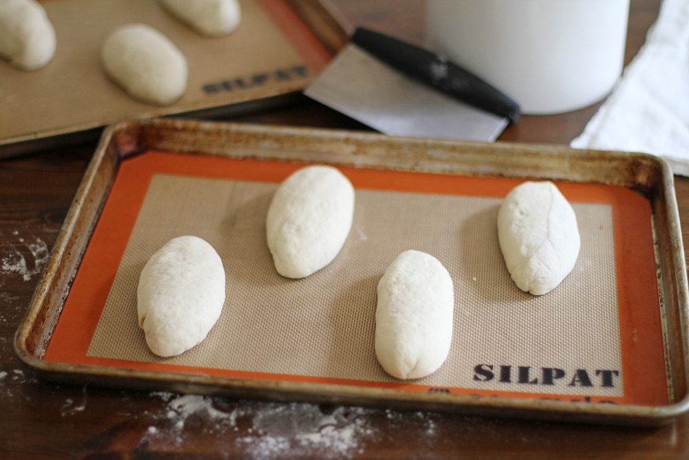 asiago herb hoagie roll dough on baking sheet