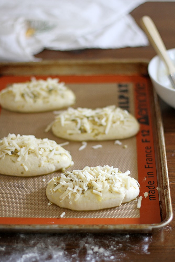 asiago cheese on top of hoagie roll dough