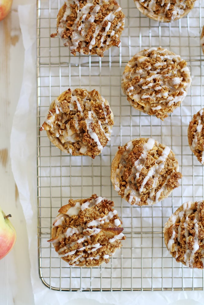 mini iced oatmeal cookie apple pies on cooling rack