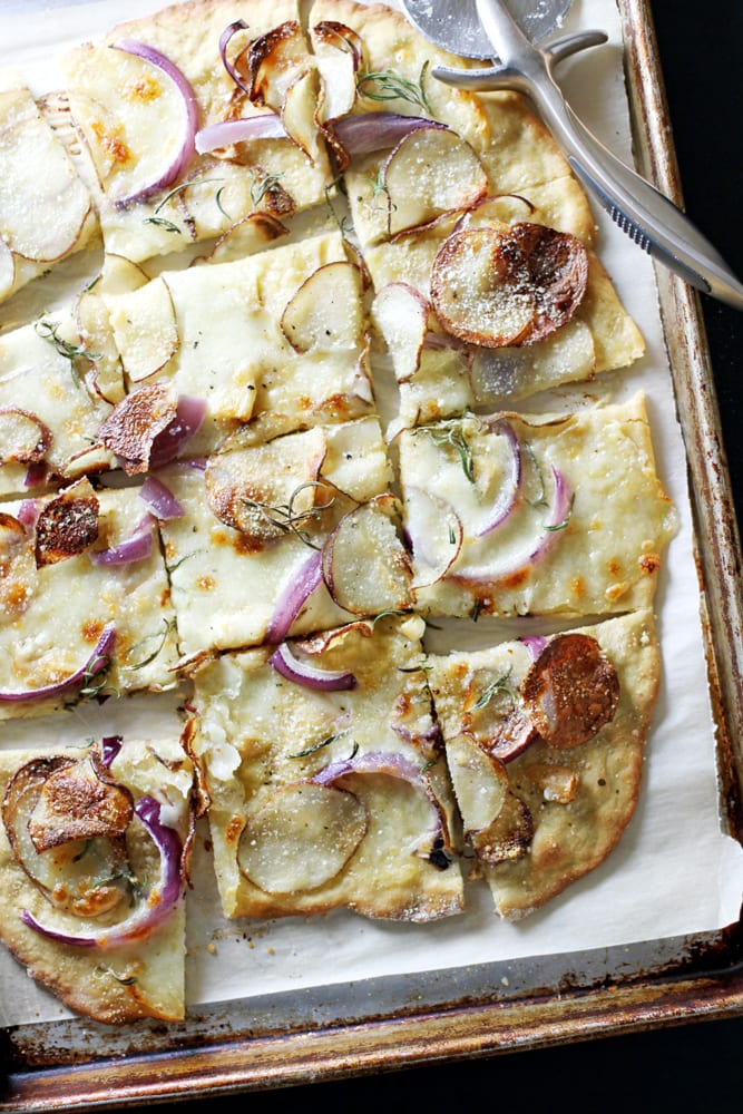 einkorn pizza crust on baking sheet