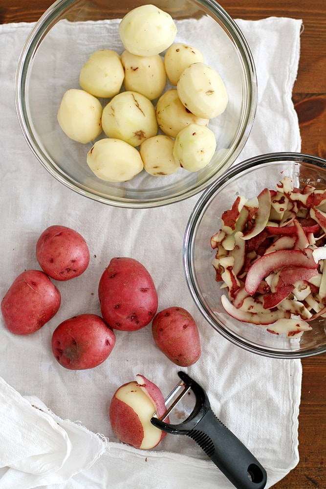 peeling potatoes on table