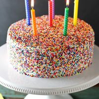 vanilla bean birthday cake on cake stand
