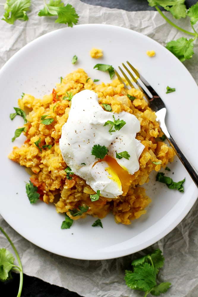 spiced lentils with poached egg on plate