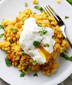spiced lentils with poached egg on plate