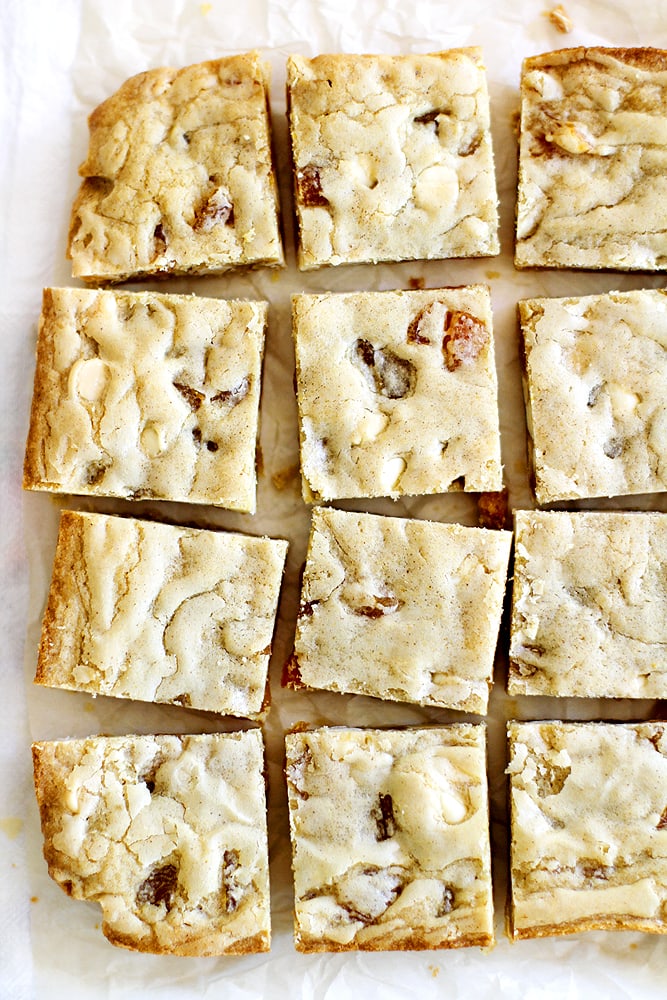 sliced apricot white chocolate brownies on parchment paper