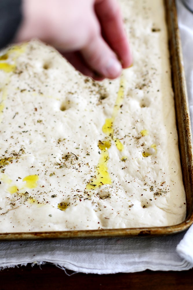 zaatar focaccia dough in baking sheet