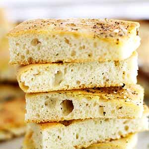 zaatar focaccia bread slices stacked.