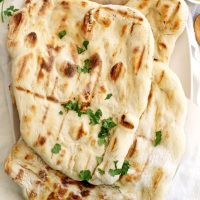 no knead grilled naan on parchment paper