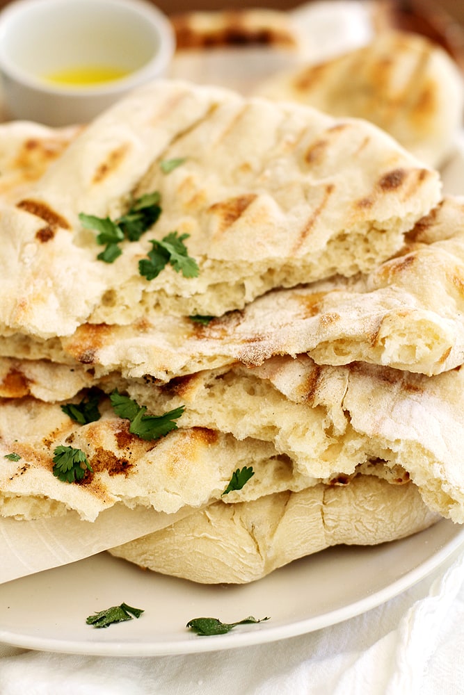 no knead grilled naan on plate