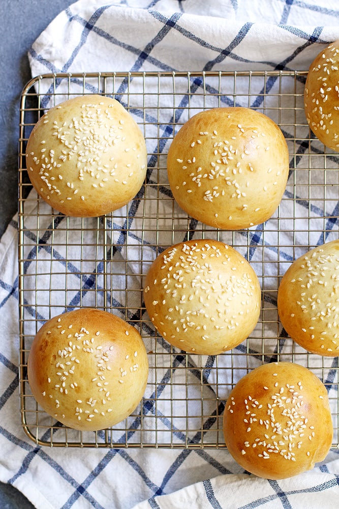 super soft hamburger buns on a cooling rack