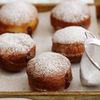 brioche donuts on baking sheet