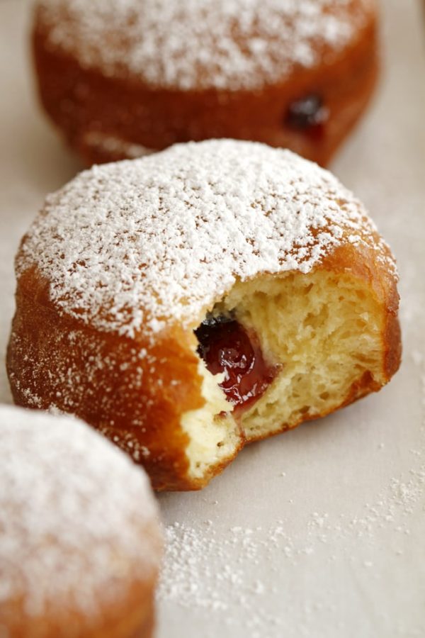 blackberry jam filling inside brioche doughnut.