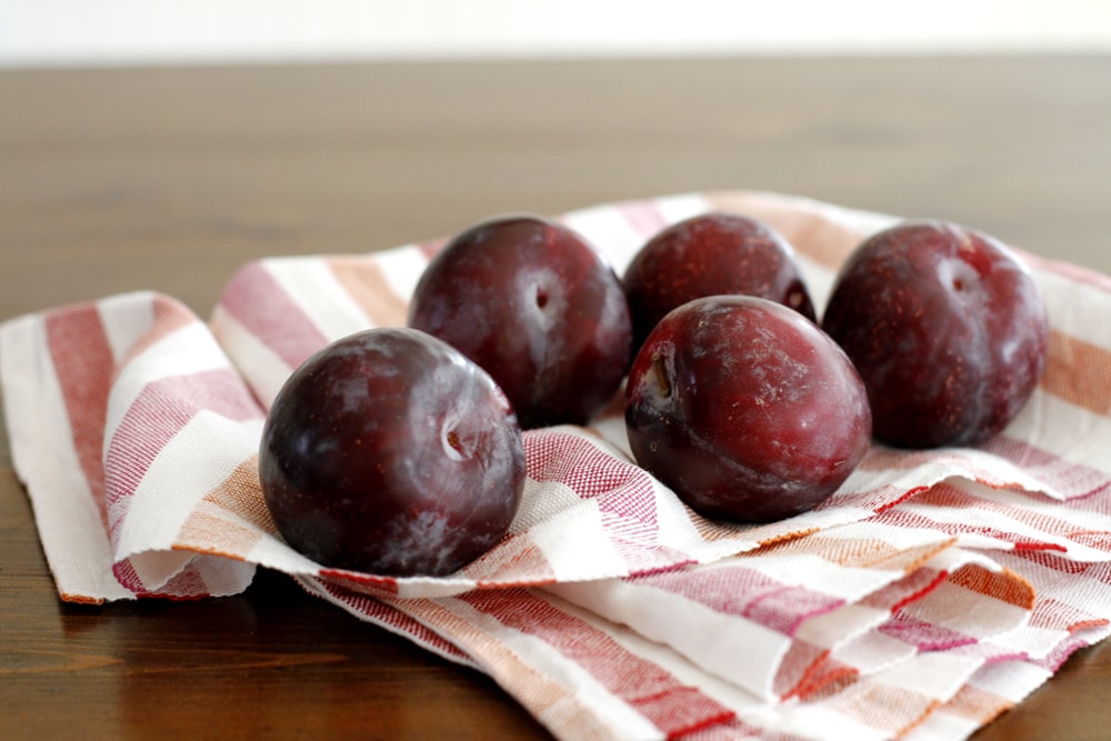 plums on a table