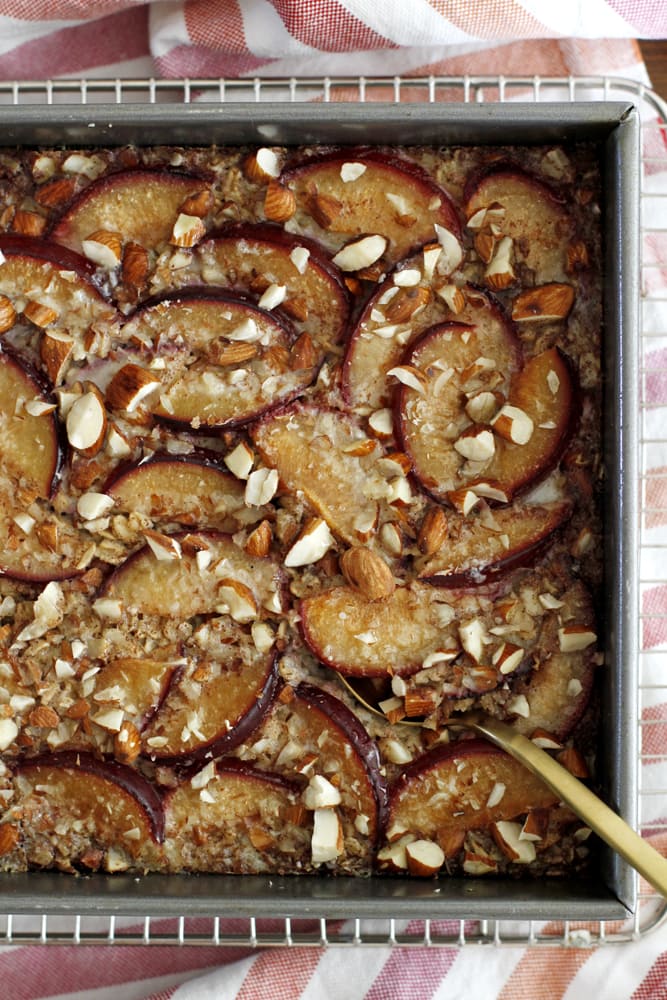 cinnamon plum baked oatmeal in pan on cooling rack