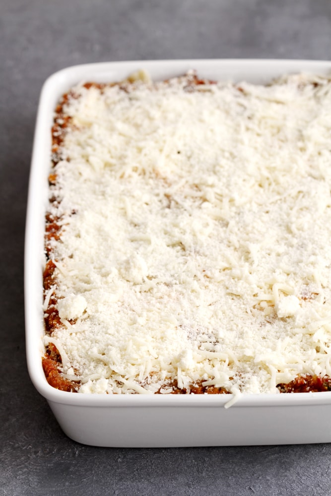 lighter lasagna bolognese in baking dish ready for oven