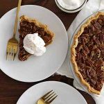 pecan pumpkin pie on plate.