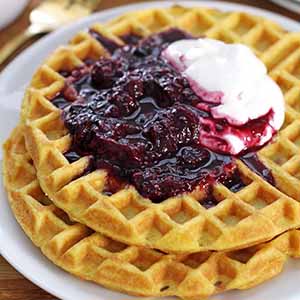 fluffy coconut flour waffles with berry compote.