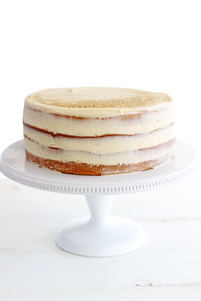 salted caramel layer cake on cake stand