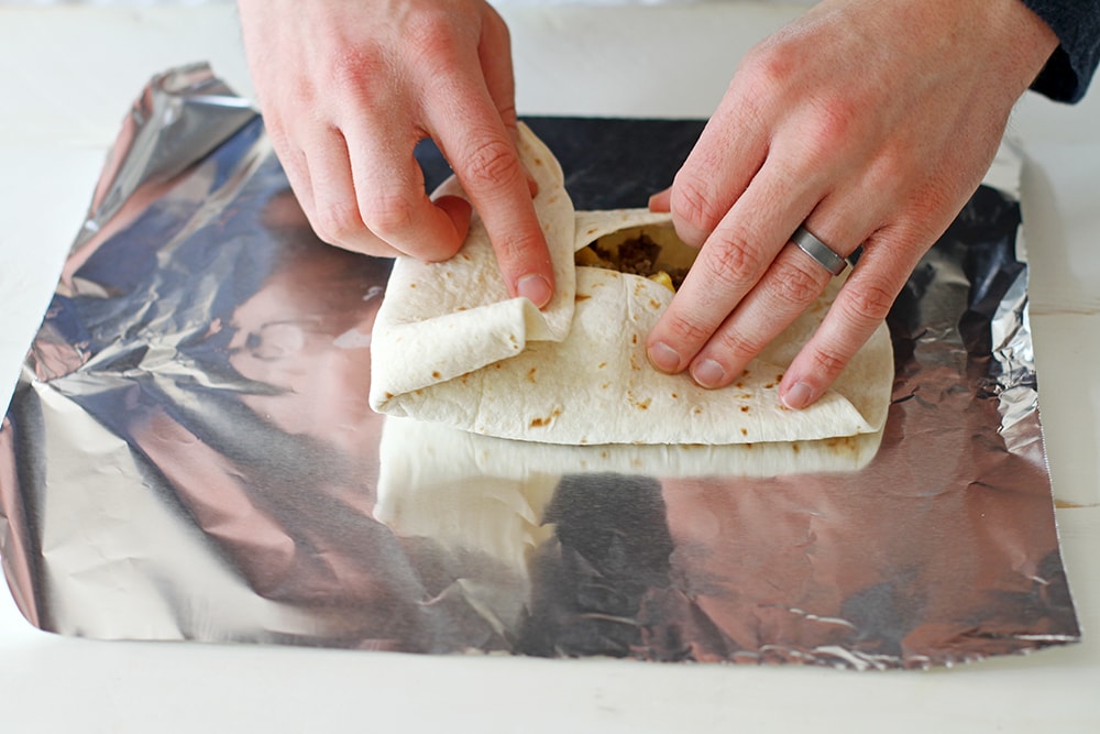 folding tortilla to make freezer breakfast burrito