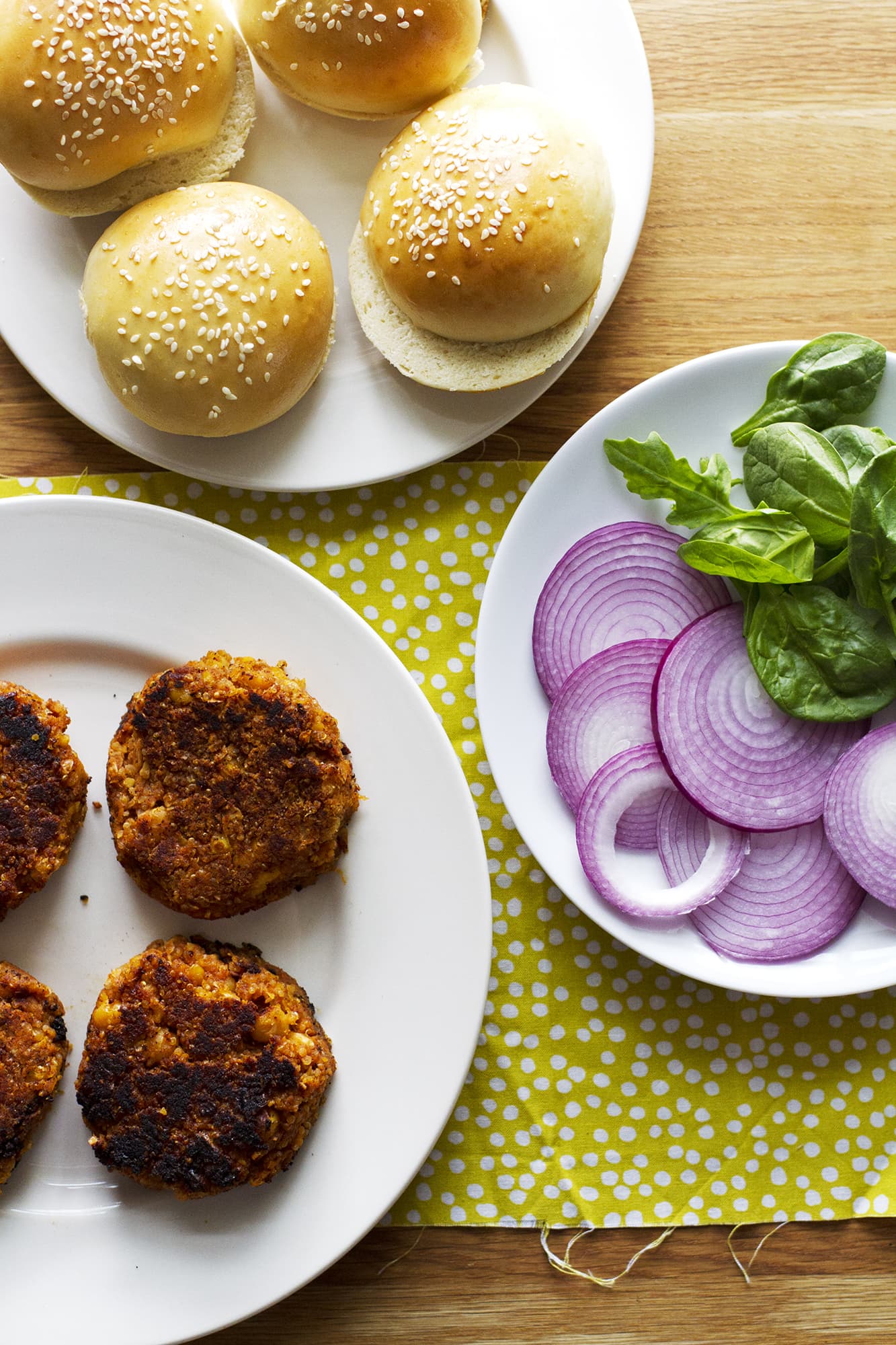 bbq veggie burgers with buns on plates