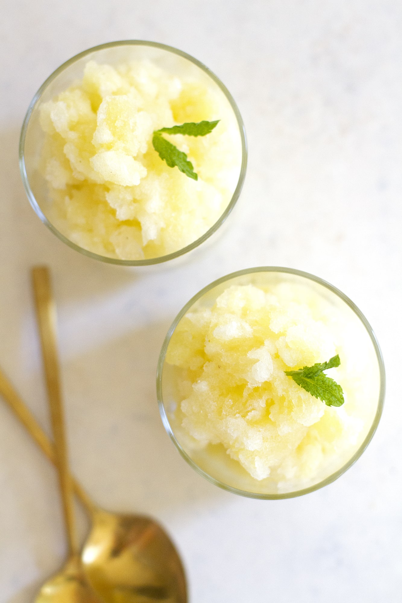 overhead view of pineapple mint granita cocktails